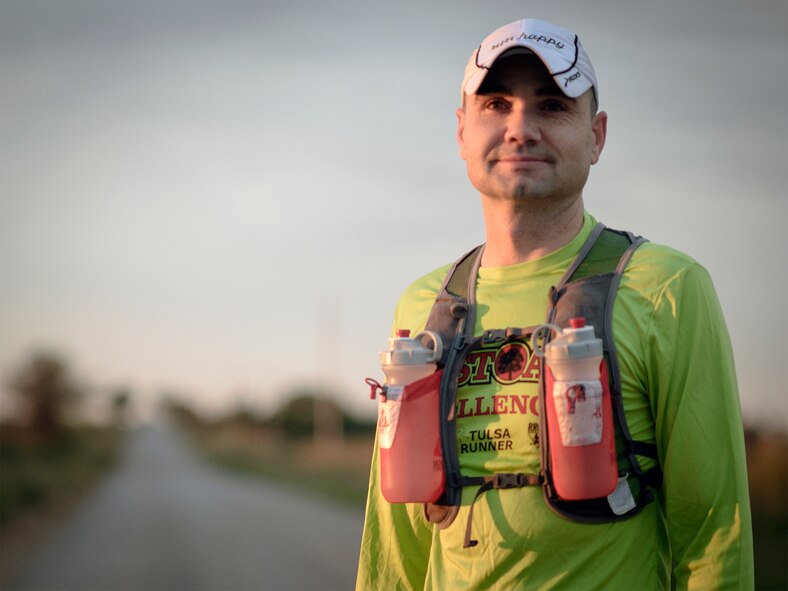 Master Sgt. Torry Brittain pauses while on an early-morning run in rural Enid, Oklahoma, Oct. 1. Brittain will attempt to run 100 miles in an ultrarunning challenge in eastern Oklahoma, Oct. 17. “Running has taught me that I’m capable of more,” he said. “Life would be very boring without challenges, and I want to see where I stack up.” (U.S. Air Force photo / David Poe) 