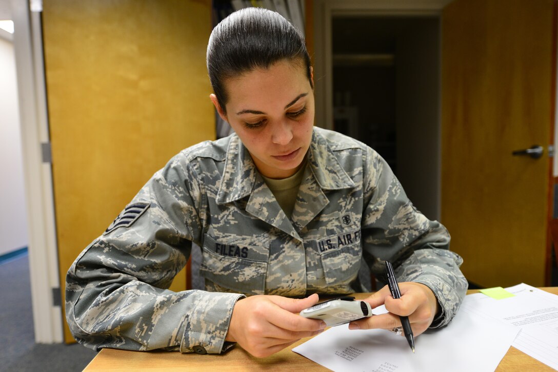U.S. Air Force Staff Sgt. Jessica Fileas, 633rd Aerospace Medicine Squadron radiation program noncommissioned officer in charge, checks an electronic personal dosimeter’s serial number while conducting inventory at Langley Air Force Base, Va., Oct. 8, 2015. The device measures exposure to ionizing radiation for the purpose of human radiation protection. (U.S. Air Force photo by Senior Airman Aubrey White/Released)