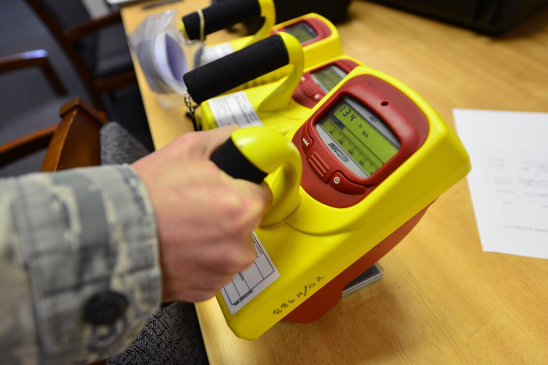 A U.S. Air Force bioenvironmental technician assigned to the 633rd Aerospace Medicine Squadron tests the functionality of an ion chamber radiation survey meter at Langley Air Force Base, Va., Oct. 8, 2015. Bioenvironmental technicians utilize the meter to evaluate community and industrial workplace environments for hazards including exposure to toxic chemicals. (U.S. Air Force photo by Senior Airman Aubrey White/Released)