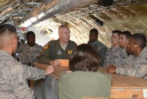 Master Sgt. Steve Stanton, a boom operator with the 465th Air Refueling Squadron, gives a pre-flight safety briefing to more than a dozen 507th Air Refueling Wing members before an incentive flight Oct. 3, 2015, at Tinker Air Force Base, Oklahoma. The flight was intended to demonstrate in-flight refueling operations to Airmen in the hopes of showing them how their efforts contribute to the Reserve mission. (U.S. Air Force photo/Senior Airman Jeffery Dahlem)