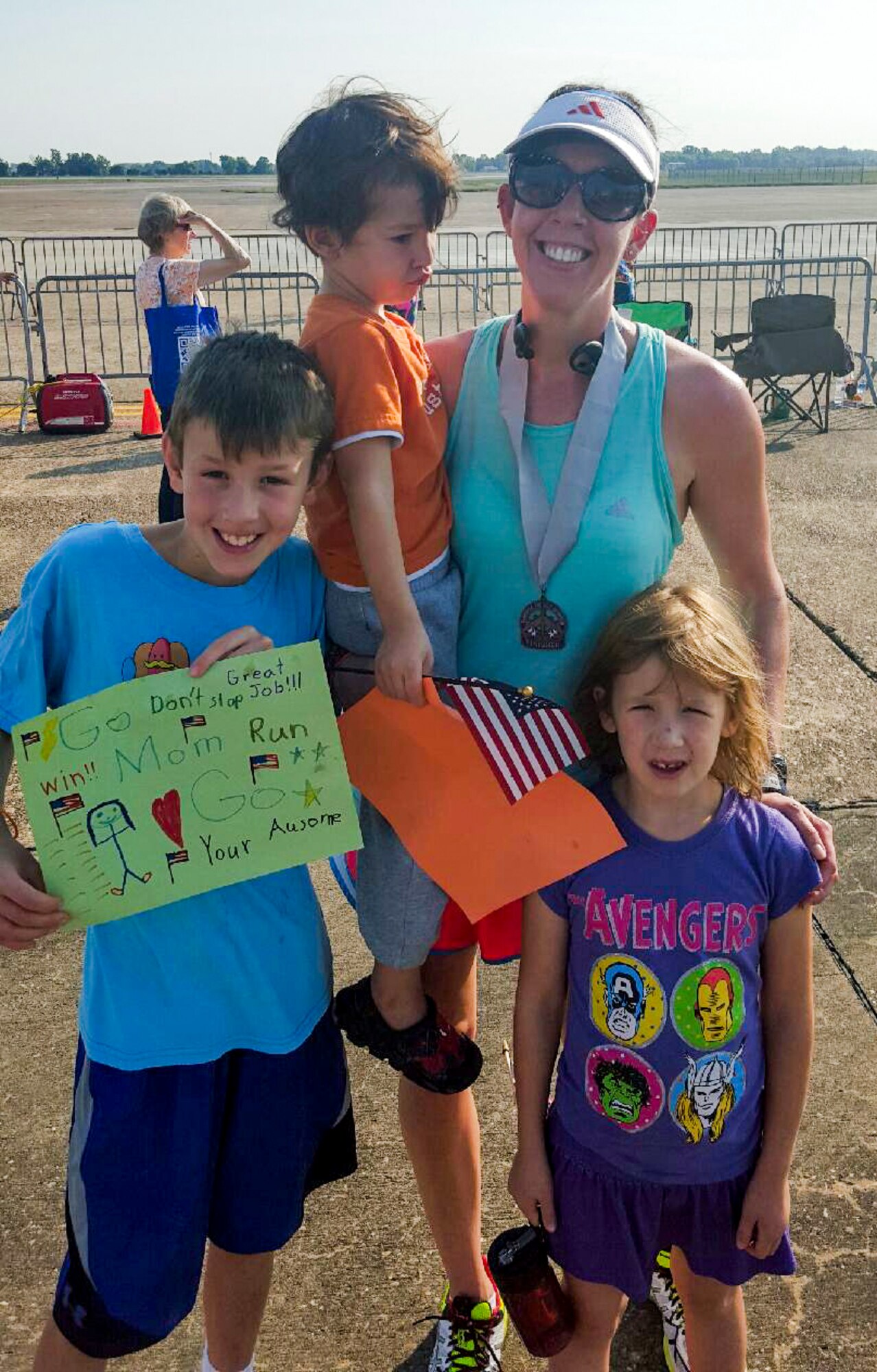 Nora Wilwert and her children pose for a photo after completing the 2015 Half Marathon and 5K hosted by the 2nd Force Support Squadron, on the flightline at Barksdale Air Force Base, La., Sept. 19, 2015. Wilwert ran the marathon to honor her fallen brother, U.S. Navy 3rd Class Petty Officer John Larimer. Larimer’s life was tragically taken in the a shooting at the Century 16 Theater in Aurora, Colo., July 20, 2012. (Courtesy Photo)