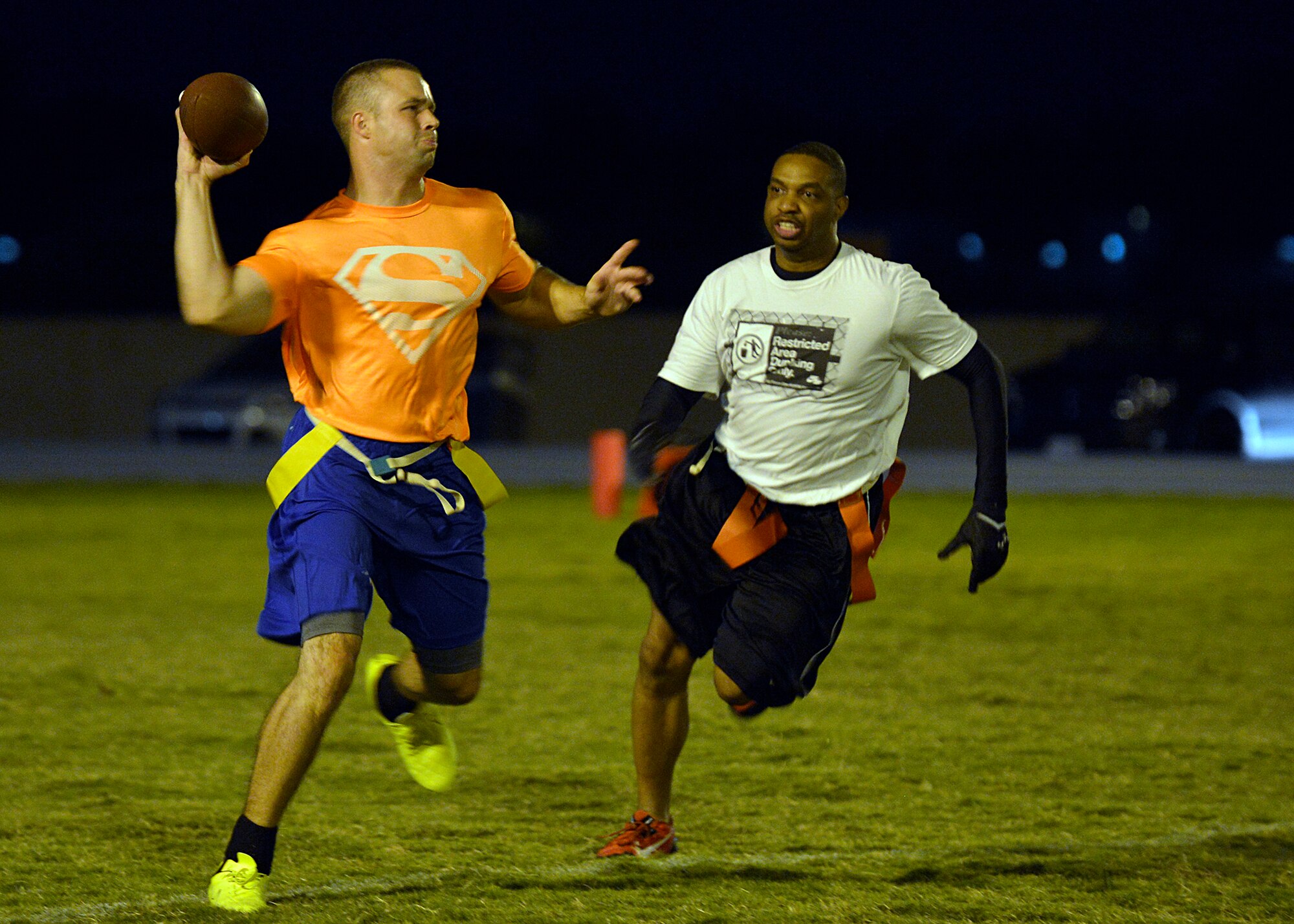 Tech. Sgt. Brandon Brown, 56th Component Maintenance Squadron, prepares to throw the ball during an intramural flag football game against AAFES at Luke Air Force Base, Ariz., Oct. 8, 2015. AAFES defeated CMS 40-34. (U.S. Air Force photo by Senior Airman Devante Williams)