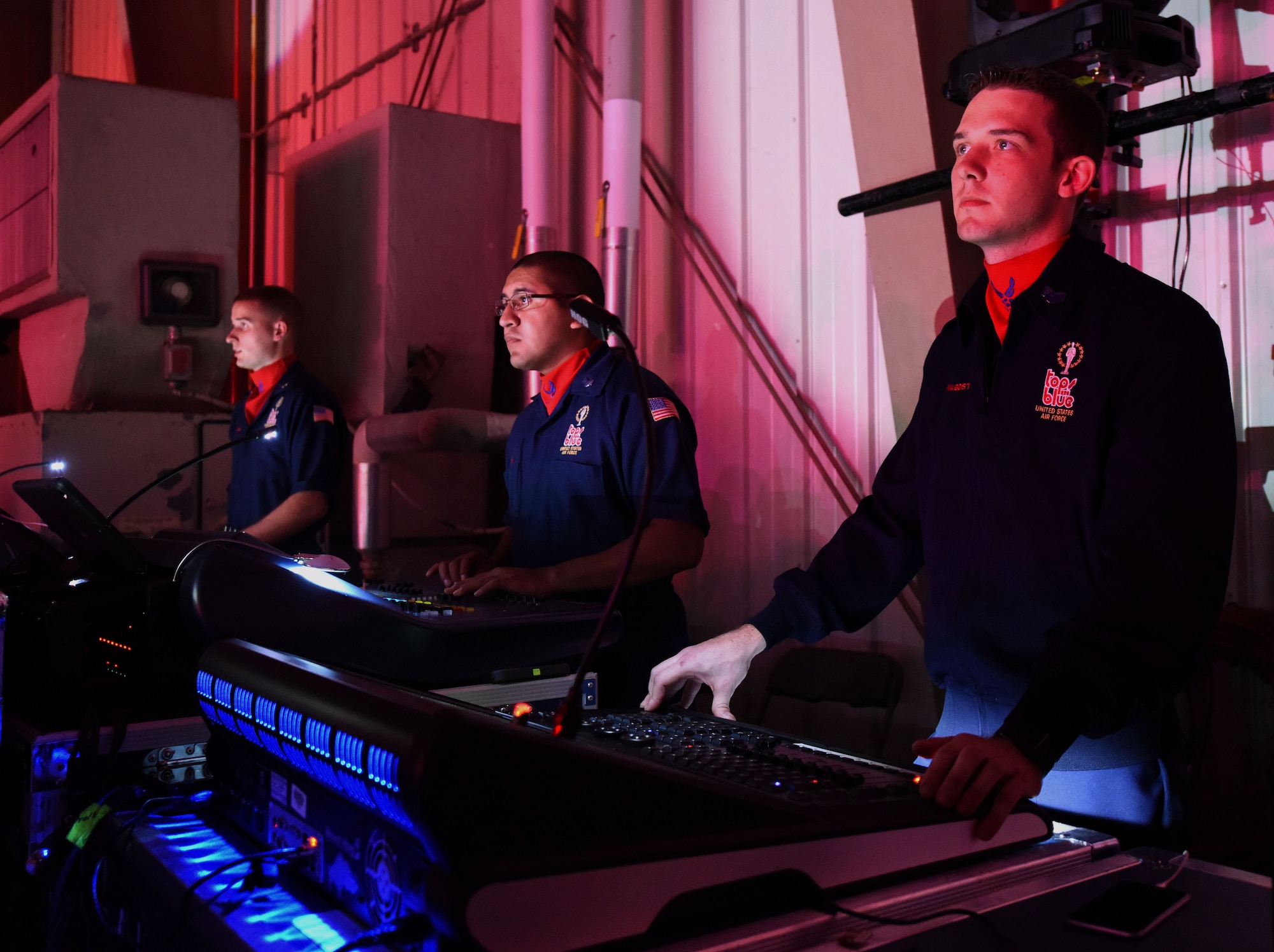 Staff Sgt. Brandon Armagost (right), 4th Logistics Readiness Squadron fuels journeyman, directs lighting and stage production with other Tops in Blue members during a performance, Oct. 9, 2015, at Seymour Johnson Air Force Base, North Carolina. Armagost was approved to be a member of this year’s Tops in Blue staff after auditioning for several years. (U.S. Air Force photo/Senior Airman Aaron J. Jenne)