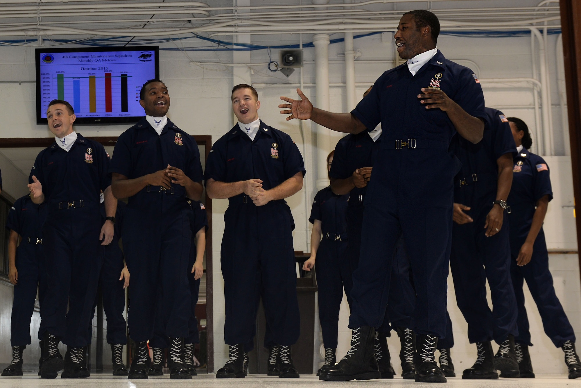 Airman 1st Class Mitchell Dixon, 4th Component Maintenance Squadron aerospace propulsion journeyman, sings with other Tops in Blue performers, Oct. 9, 2015, at Seymour Johnson Air Force Base, North Carolina. Dixon was able to perform for his squadron during this stop on Tops in Blue’s worldwide tour. (U.S. Air Force photo/Airman 1st Class Ashley Williamson)