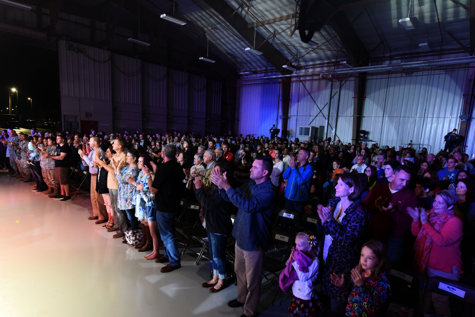 The audience gives Tops in Blue a standing ovation as the show concludes, Oct. 10, 2015, at Seymour Johnson Air Force Base, North Carolina. On this tour, Tops in Blue is performing more than 75 shows in 20 countries. (U.S. Air Force photo/Senior Airman Aaron J. Jenne)