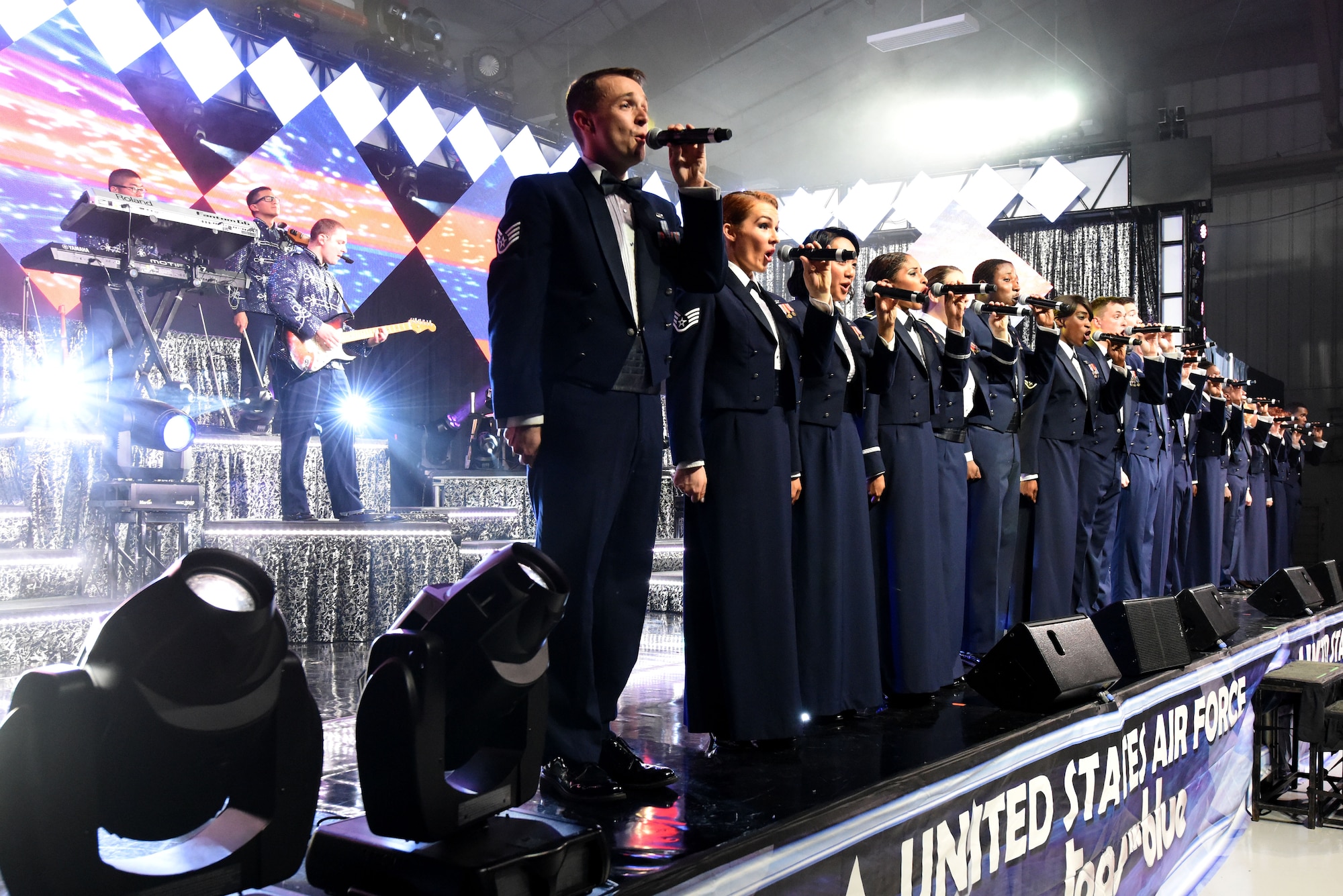 Tops in Blue closes out the show with a rendition of the Air Force song while in their mess dress, Oct. 10, 2015, at Seymour Johnson Air Force Base, North Carolina. Tops in Blue has been providing entertainment to service members around the globe for more than 60 years. (U.S. Air Force photo/Senior Airman Aaron J. Jenne)