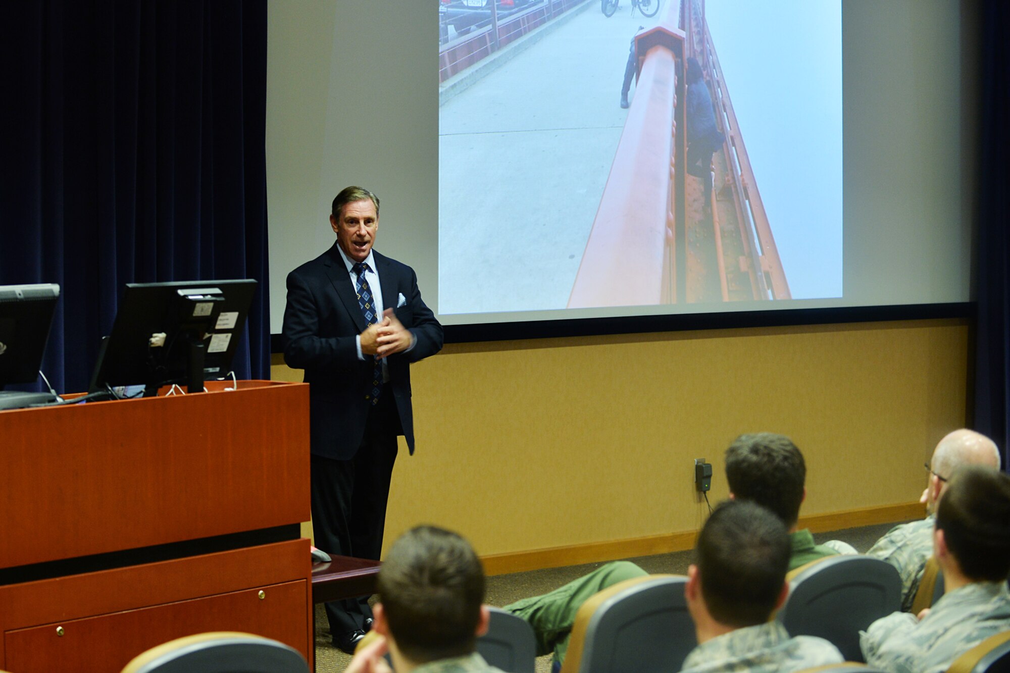 Retired California Highway Patrol Officer Sergeant Kevin R. Briggs speaks to members of Team Offutt in the 557th Weather Wing Auditorium, Offutt Air Force Base, Neb. During his 23 years as an officer, Briggs talked to hundreds of Americans attempting to jump off the Golden Gate Bridge and only two instances ended in fatalities. (U.S. Air Force photo by Charles Haymond/Released)