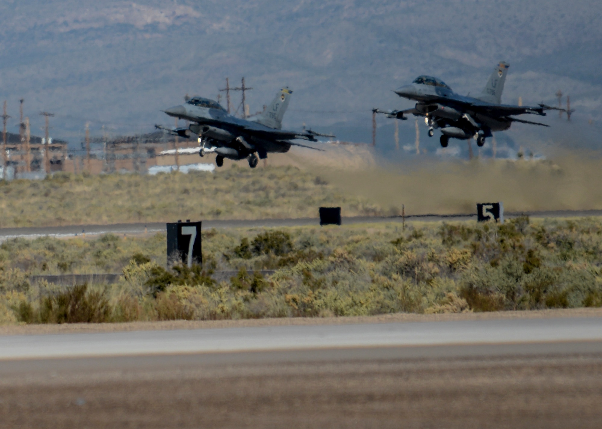 Two F-16 Fighting Falcon’s take off the runway at Holloman Air Force Base, N.M., Oct. 13. The F-16’s are part of the 311th and 314th Squadrons who are responsible for training skilled and efficient F-16 fighter pilots for the Combat Air Force. (U.S. Air Force photo by Airman 1st Class Randahl J. Jenson)  