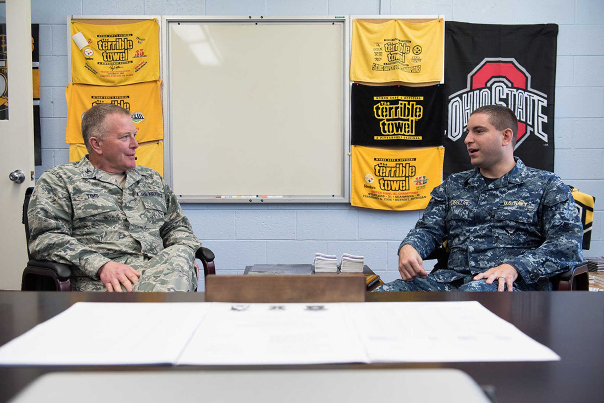Chaplain (Lt.) Brett Sabella, U.S. Navy chaplain, and Chaplain (Col.) James Tims, Air Mobility Command chaplain, discuss matters about the joint base chaplain’s office at Joint Base McGuire-Dix-Lakehurst, N.J., Oct. 14, 2015. Tims’ visit gave him a chance to see the installation chaplains and chaplain assistants performing their mission first-hand. (U.S. Air Force photo by Russ Meseroll/Released)