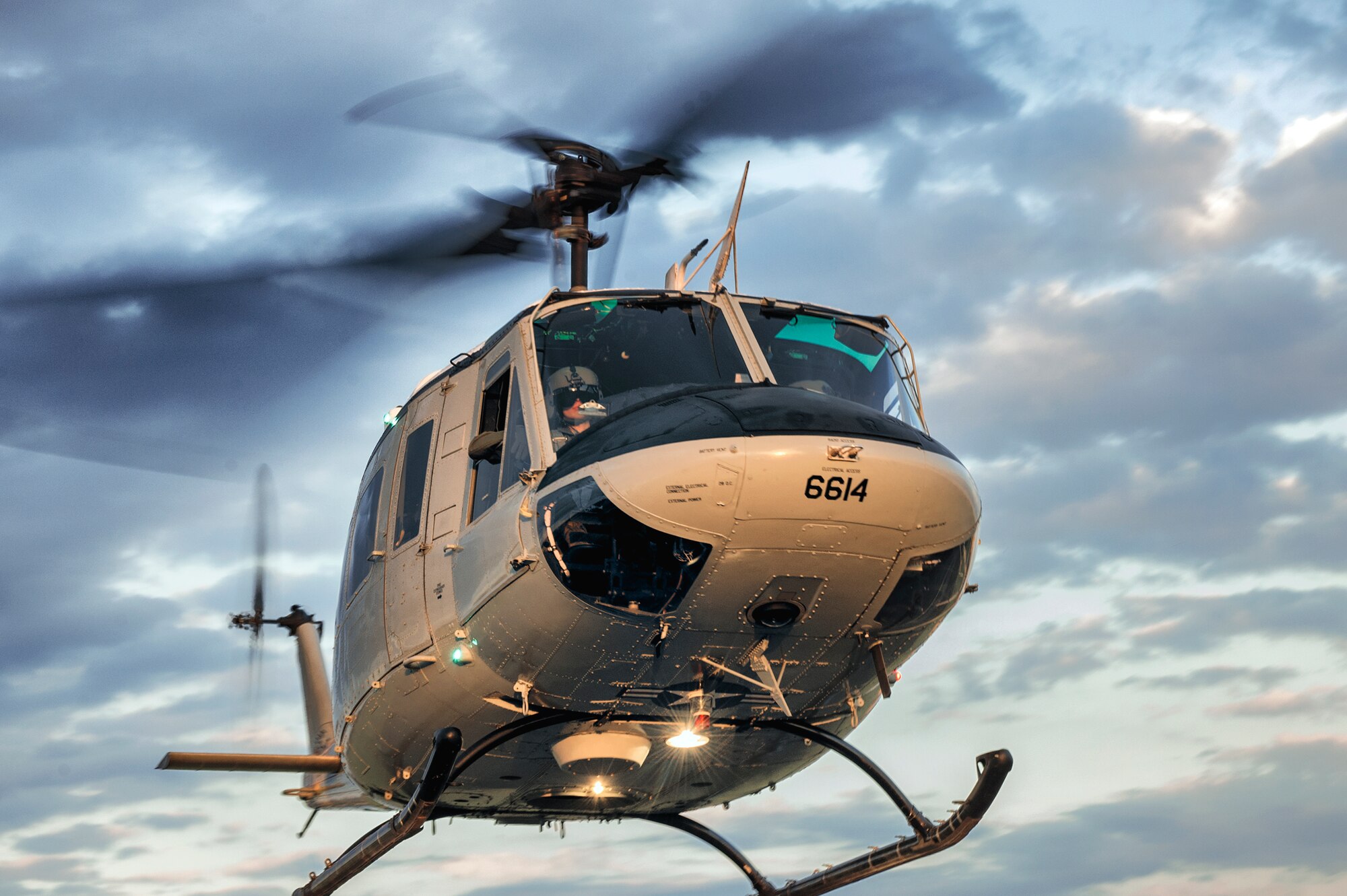 A UH-1N Huey takes off from a landing zone at Yokota Air Base, Japan, Oct. 13, 2015. Airmen from the 459th Airlift Squadron regularly practice their airlift capabilities in order to respond to regional contingencies. (U.S. Air Force photo by Airman 1st Class Delano Scott/Released)
