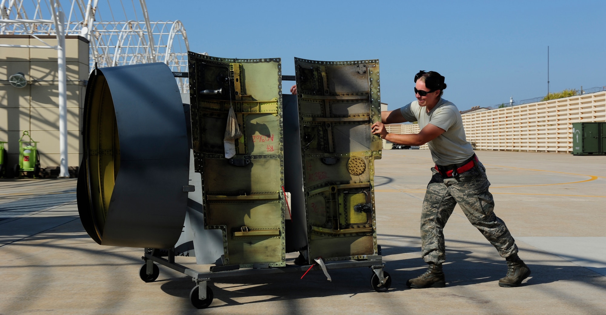 Senior Airman Elizabeth Nearing, 134th Expeditionary Fighter Squadron F-16 Fighting Falcon crew chief, Vermont Air National Guard, pushes the engine panels of an F-16 at Kunsan Air Base, Republic of Korea, Oct. 6, 2015. The 134th EFS was redeployed from Kadena Air Base, Japan to Kunsan AB as part of a theater security package. TSPs are one of Pacific Air Forces’ contributions to Theater Security Cooperation as the U.S. air component in the region and they ensure shared international responsibilities to provide assistance during regional crises. (U.S. Air Force photo by Staff Sgt. Nick Wilson/Released)