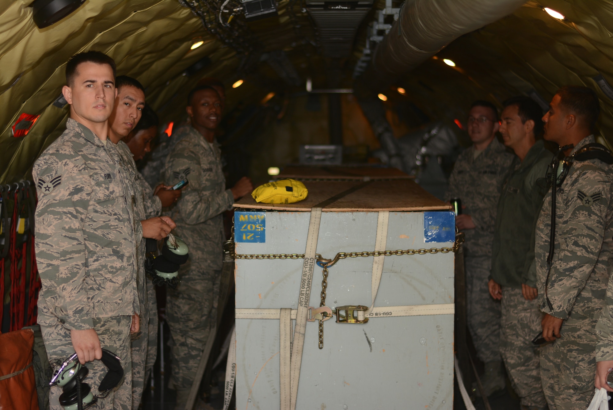 A group of Airmen from the 507th Air Refueling Wing wait as the flight crew completes the pre-flight checklist before departing on an incentive flight aboard a KC-135R Stratotanker Oct. 3, 2015, at Tinker Air Force Base, Okla. The Airmen were chosen by their leadership to be a part of the incentive flight, giving them a chance to see how their individual duties contribute to the 507th ARW’s refueling mission. (U.S. Air Force photo/Senior Airman Jeffery Dahlem)