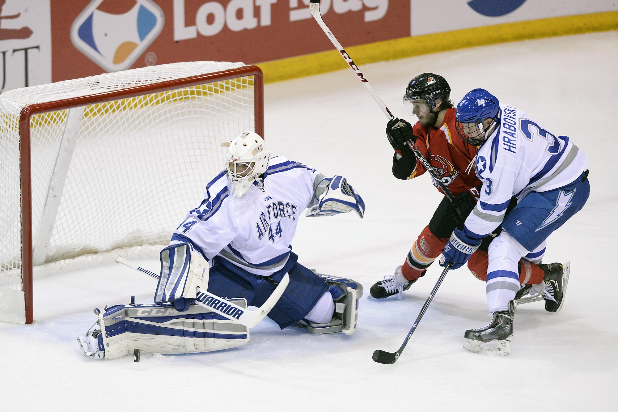 Billy Christopoulos, goalie for the U.S. Air Force Academy Falcons, deflects a shot as the Falcons met the University of Calgary Dinos in an exhibition college hockey matchup at the Academy's Cadet Ice Arena in Colorado Springs, Colo., Oct. 5, 2015. The Falcons defeated Calgary 5-0. Air Force opened its regular season against the No. 5 ranked University of Denver Pioneers at the Cadet Ice Arena Oct. 9. (U.S. Air Force photo/Mike Kaplan)