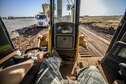 Staff Sgt. Logan Pals, a 435th Construction Training Squadron pavements and construction equipment operator, sits in the seat of a bulldozer while waiting for gravel to be dumped Sept. 24, 2015, at Diyarbakir Air Base, Turkey. The 435th CTS have more than 10 construction vehicles that are used to dump, move, grade and roll gravel throughout the base. (U.S. Air Force photo/Airman 1st Class Cory W. Bush)