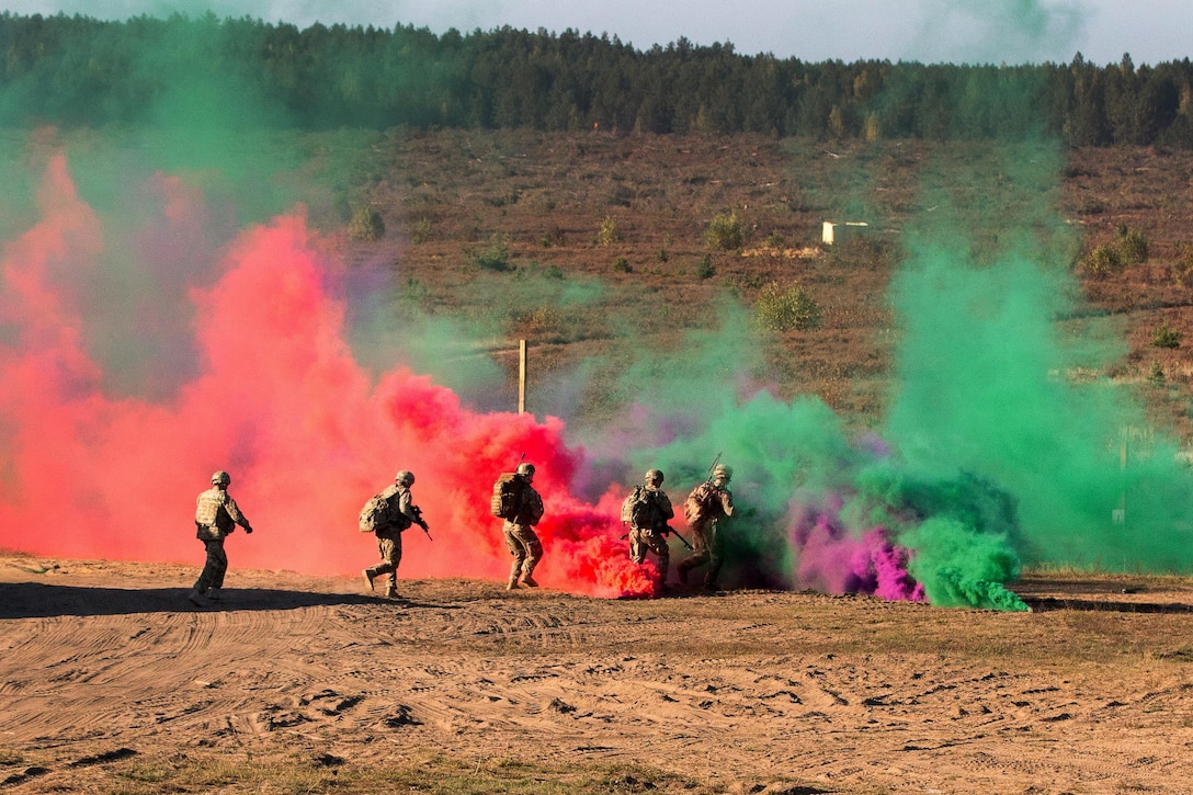 U.S. soldiers move into a fire position during a combined arms live-fire exercise in Pabrade, Lithuania, Oct. 14, 2015. The soldiers are assigned to the 1st Battalion, 503rd Infantry Regiment, 173rd Airborne Brigade. The training event was part of Operation Eagle Shock, a training exercise between the 173rd Airborne Brigade and the Lithuanian Land Forces. U.S. Army photo by Staff Sgt. Michael Behlin