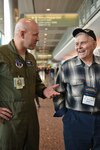 Nine Airmen of the Alaska Air National Guard's 249th Airlift Squadron connected with more than 20 World War II and Korean War veterans, assisting them at Ted Stevens International Airport on Oct. 13, 2015. The Alaska veterans were participants of the Last Frontier Honor Flight, an organization taking them to Washington, D.C., to see for the first time the monuments erected there to honor those who served during those conflicts.