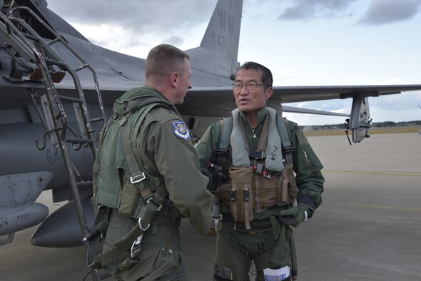 Lt. Gen. John Dolan, the U.S. Forces Japan commander, and Japan Air Self-Defense Force Lt. Gen. Yoshiyuki Sugiyama, the Air Defense Command commander, thank each other for the opportunity to demonstrate a great show of friendship by making a bilateral exchange flight possible at Misawa Air Base, Japan, Oct. 14, 2015. (U.S. Air Force photo/Senior Airman Jose L. Hernandez-Domitilo)
