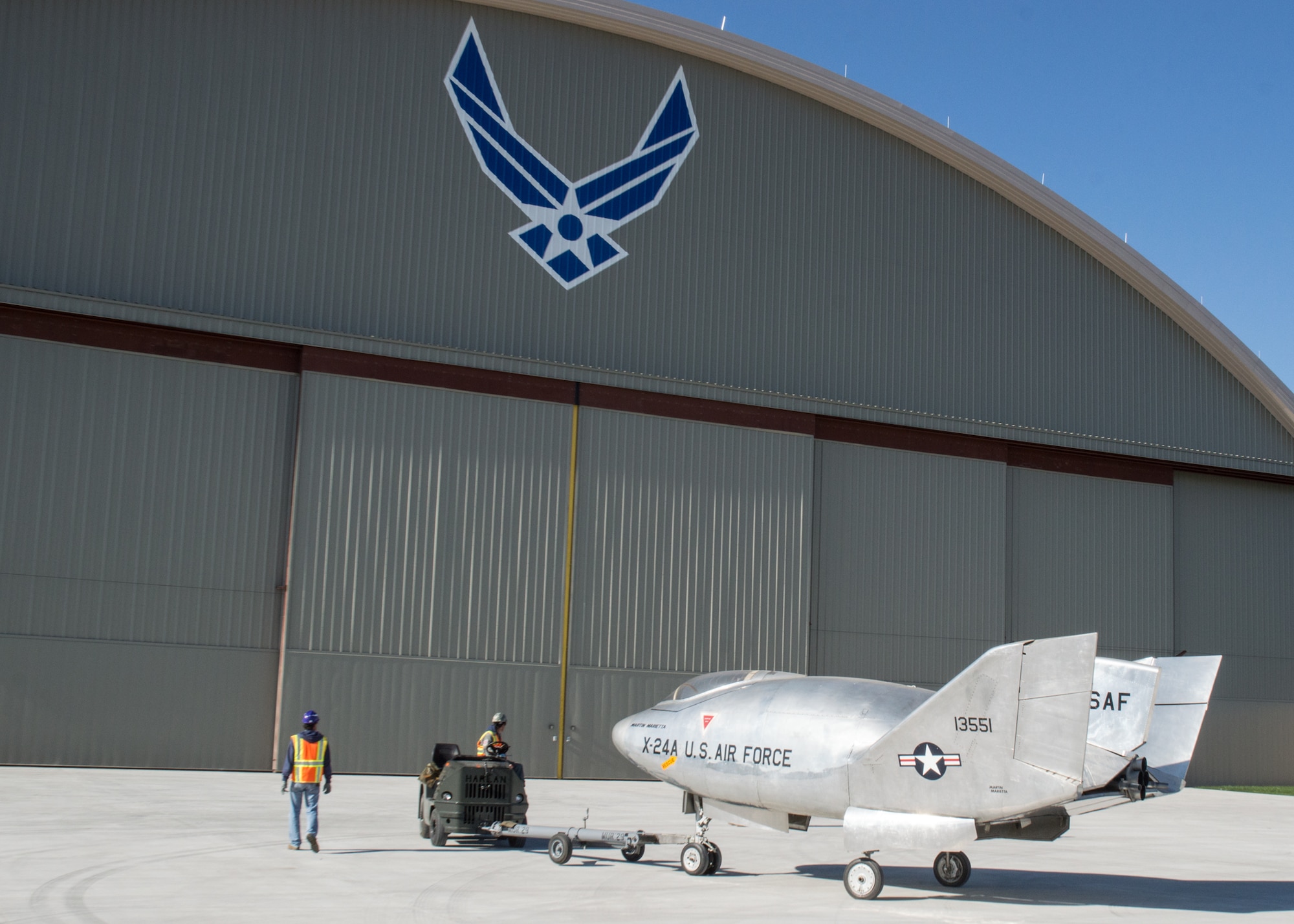 Restoration staff move the Martin X-24A into the new fourth building at the National Museum of the U.S. Air Force on Oct. 14, 2015. (U.S. Air Force photo by Ken LaRock)