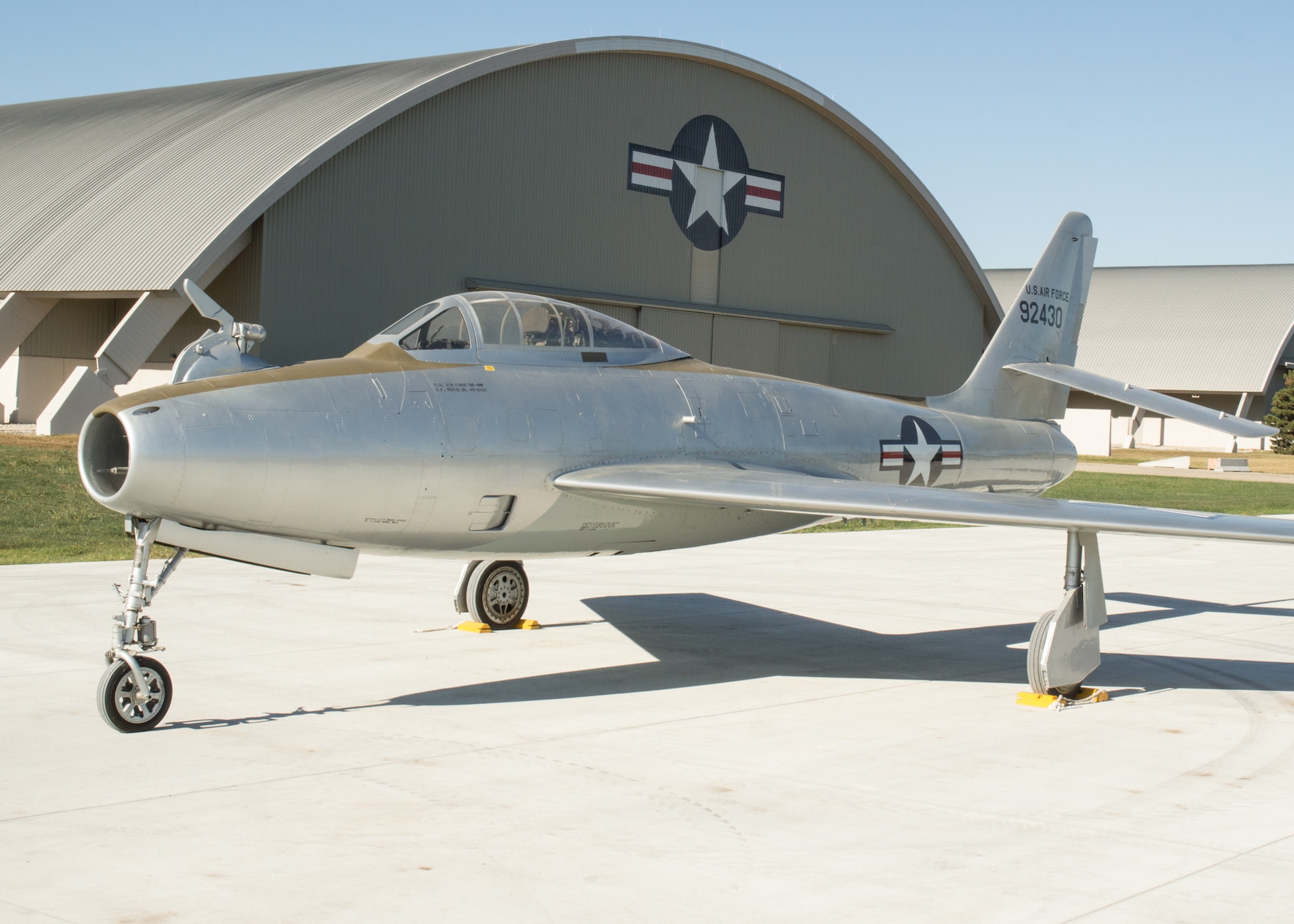 Restoration staff move the Republic YRF-84F Ficon into the new fourth building at the National Museum of the U.S. Air Force on Oct. 8, 2015. (U.S. Air Force photo by Ken LaRock)