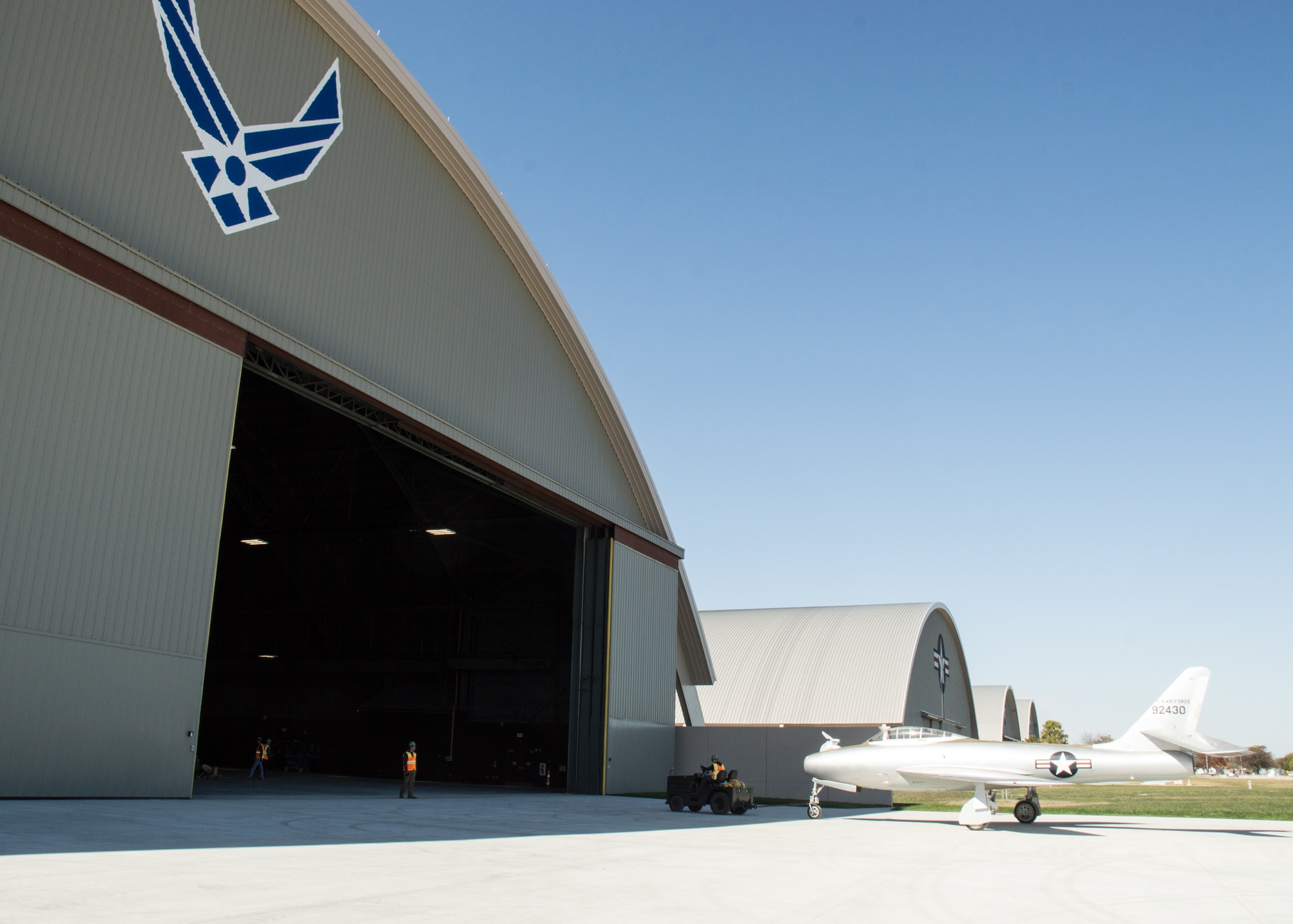 Restoration staff move the Republic YRF-84F Ficon into the new fourth building at the National Museum of the U.S. Air Force on Oct. 8, 2015. (U.S. Air Force photo by Ken LaRock)