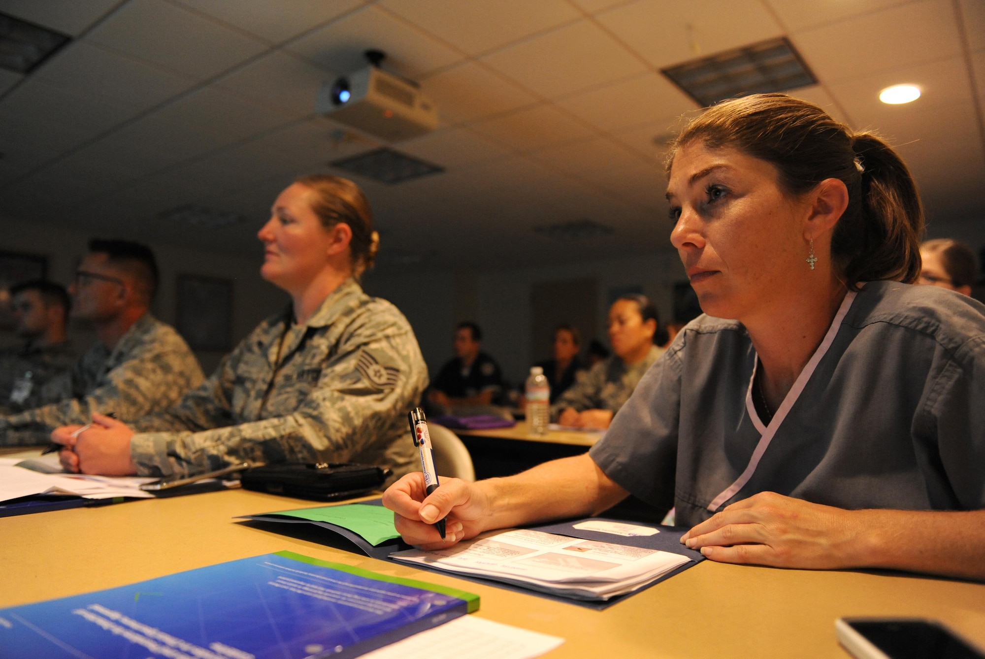 Tiffany Cook, 81st Diagnostic and Therapeutics Squadron medical laboratory technician, takes notes during an anaerobic bacteriology workshop at the Keesler Medical Center Oct. 13, 2015, Keesler Air Force Base, Miss. Seventeen individuals attended the one-day workshop which provided an update in anaerobic microbiology for the clinical laboratory. Students received a lecture and a practical exam which consisted of identifying unknown organisms. This is the first workshop of this kind to take place in the Air Force. (U.S. Air Force photo by Kemberly Groue)