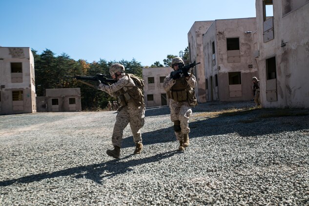 Marines from Alpha Company, Marine Barracks Washington, D.C. conduct exterior movements from building to building during a military operations in urban terrain exercise at Marine Corps Base Quantico, Va. Oct. 15, 2015.  (U.S. Marine Corps photo by Cpl. Christian Varney/Released)