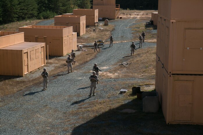 Marines from Alpha Company, Marine Barracks Washington, D.C. patrol an area with a suspected sniper during a military operations in urban terrain exercise at Marine Corps Base  Quantico, Va. Oct. 15, 2015.  (U.S. Marine Corps photo by Cpl. Christian Varney/Released)