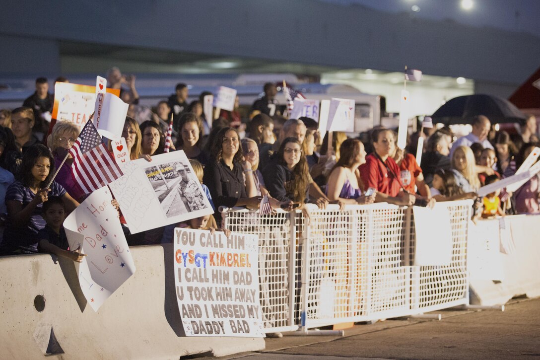 Family members and friends wait for the return of Marine Fighter Attack Squadron (VMFA) 232 aboard Marine Corps Air Station Miramar, Calif., Oct. 16. Service members, friends and family members greeted Marines and Sailors as they returned from a six-month deployment. (U.S. Marine Corps photo by Sgt. Lillian Stephens/Released)
