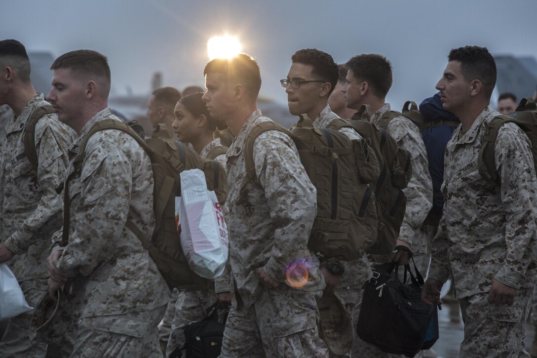 Marines and Sailors with Marine Fighter Attack Squadron (VMFA) 232 return from a six-month deployment to Marine Corps Air Station Miramar, Calif., Oct. 16. Fellow service members, friends and family members greeted the Marines and Sailors on the flight line of MCAS Miramar. (U.S. Marine Corps photo by Sgt. Lillian Stephens/Released)