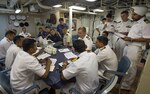 CHENNAI, INDIA (October 13, 2015) Officers from Indian Navy, Japan Maritime Self Defense Force and U.S. Navy meet together for an Executive Officer’s Call in the wardroom of the littoral combat ship USS Fort Worth (LCS 3) as part of Exercise Malabar.  Currently on a 16-month rotational deployment in support of the Indo-Asia-Pacific Rebalance, Fort Worth is a fast and agile warship tailor-made to patrol the region’s littorals and work hull-to-hull with partner navies, providing 7th Fleet with the flexible capabilities it needs now and in the future. 