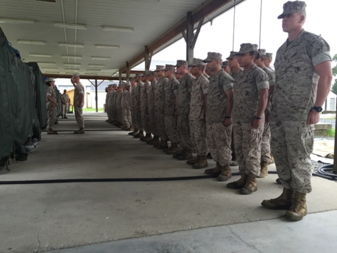 On October 1, 2015 Marines from Basic Engineer Equipment Electrical Systems Technician (BEEEST) courses 8-15, 9-15, and 1-16 stand in formation as three Marines are promoted to the rank of Private First Class at Marine Corps Engineer School, Camp Lejeune, N.C.


