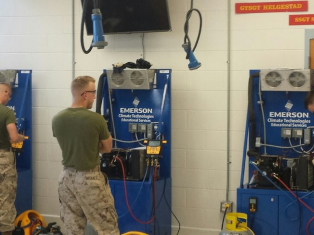 Private First Class Justin Becraft from Basic Refrigeration and Air Conditioning Technician course 6-15 (BRACT 6-15) conducts a practical application on charging, recovering, and evacuating refrigeration systems using tools from the cooling and refrigeration expeditionary tool kit at Marine Corps Engineer School, Camp Lejeune, N.C.
