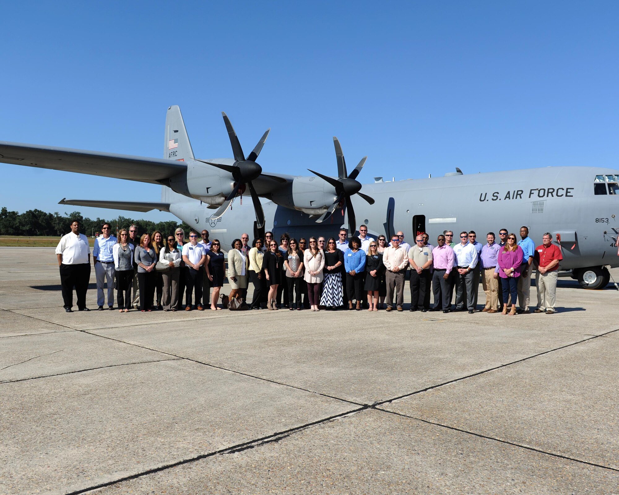 Members of the Leadership Gulf Coast pose for a group photo in front of a C-130J Oct. 14, 2015, Keesler Air Force Base, Miss. Leadership Gulf Coast is a Chamber of Commerce program designed to prepare the area’s current and potential leaders for the future. The group was also provided a windshield tour of the base and ate lunch at the Bay Breeze Event Center. (U.S. Air Force photo by Kemberly Groue)