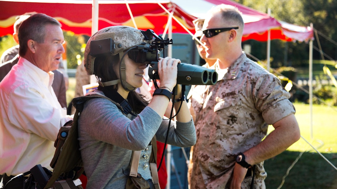 A visitor experiences the Augmented Immersive Team Training system during a demonstration for Marine leadership and key civilian leaders at the Medal of Honor Golf Course, Marine Corps Base Quantico, Virginia, Oct. 14, 2015. The system provides a virtual battlefield complete with aircraft and artillery to engage ground vehicles and personnel with no needs for concerns such as safety, resources or availability of ranges for realistic training.
