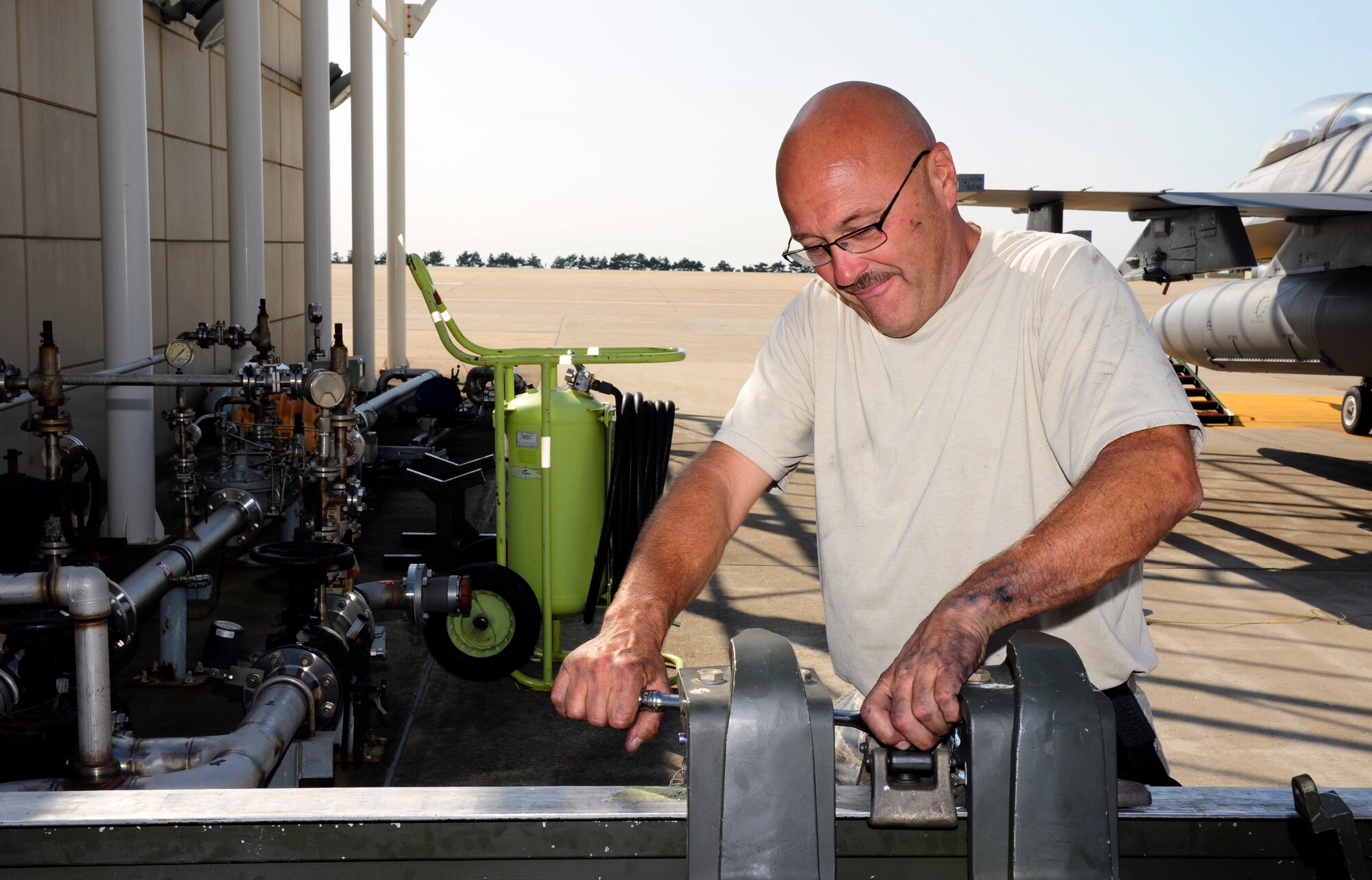 U.S. Air Force Senior Master Sgt. Paul Miscavage, 134th Expeditionary Fighter Squadron propulsion superintendent, Vermont Air National Guard, works on an engine removal and installation at Kunsan Air Base, Republic of Korea, Oct. 6, 2015. The 134th EFS was redeployed from Kadena Air Base, Japan to Kunsan AB as part of a theater security package. The 134th Expeditionary Fighter Squadron deployed to Kunsan as part of a rotational theater security package to solidify U.S. relationships with international partners. (U.S. Air Force photo by Staff Sgt. Nick Wilson/Released)