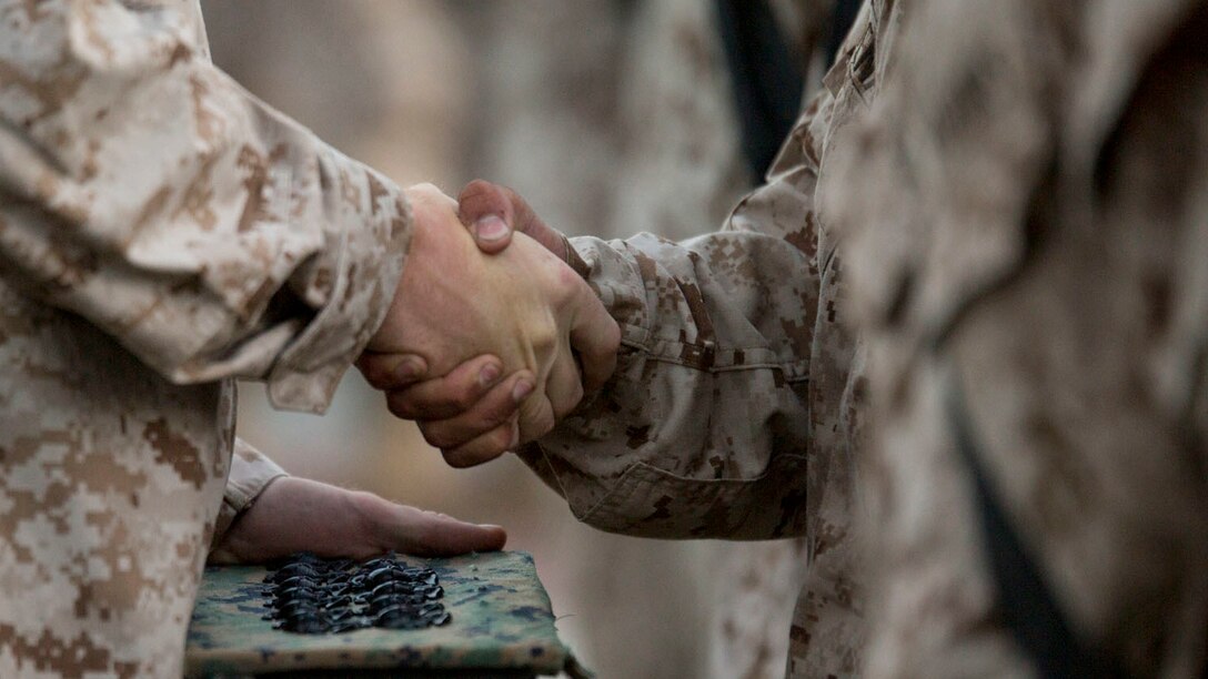 During an emblem ceremony Oct. 25, 2014, recruits of Kilo Company, 3rd Recruit Training Battalion, earned their Eagle, Globe and Anchor emblems and shook hands with the drill instructors who led them on the journey to earn the title Marine at Marine Corps Recruit Depot Parris Island, S.C. Only those imbued with the Corps’ core values can earn the title Marine. 