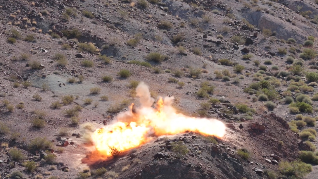 M2A4 shaped charges explode as part of an excavation operation at Rainbow Canyon Training Area, Oct. 8, 2015. The excavation will be used for the placement of wildlife guzzlers to promote the migration of Big Horn Sheep through the area. (Official Marine Corps photo by Lance Cpl. Thomas Mudd/Released)