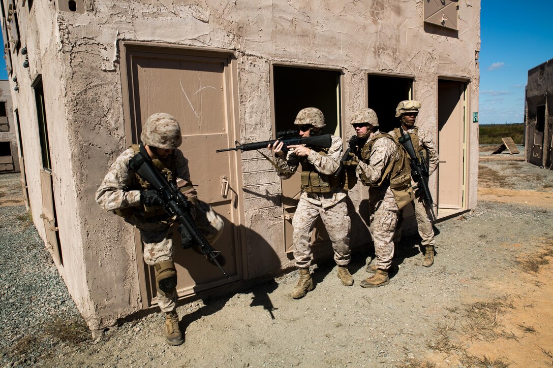 Marines from Alpha Company, Marine Barracks Washington, D.C. stack up to breach a doorway during military operations on urban terrain exercise at Marine Corps Base, Quantico, Va. Oct. 15, 2015.  (U.S. Marine Corps photo by Cpl. Christian Varney/Released)