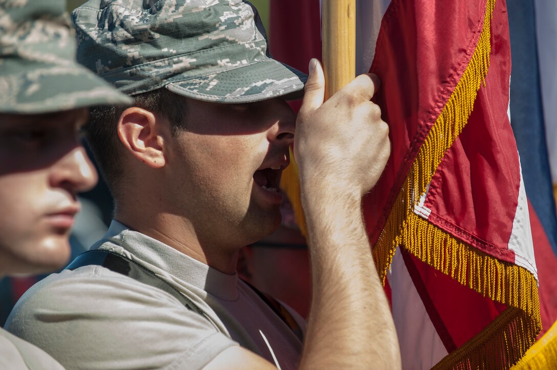A member of the Nellis Air Force Base Honor Guard shouts a command during a team practice session at Nellis AFB, Nev., Oct. 13, 2015. Each member of the team must commit to a four-month, full-time commitment, taking the member out of their assigned career field in a temporary, career-broadening assignment. (U.S. Air Force photo by Staff Sgt. Siuta B. Ika)