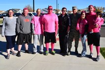 Col. Tom Wilcox, 341st Missile Wing commander, poses with a group of attendees at the breast cancer awareness walk and run Oct. 15, 2015, at Malmstrom Air Force Base, Mont. Nearly 210 people showed up to the event to show support and awareness of breast cancer. (U.S. Air Force photo/Airman Daniel Brosam)