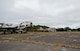 A range police vehicle rolls by old military equipment while on patrol Oct. 6 at Eglin Air Force Base, Fla.  The range police are responsible for the safety and security of Eglin range’s mission, people and environment.  (U.S. Air Force photo/Samuel King Jr.)