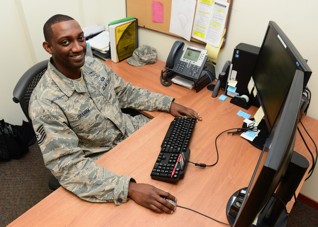 U.S. Air Force Tech. Sgt. Billy Graham, 31st Medical Group training manager, was named the 31st Fighter Wing’s “Wyvern Warrior of the Week,” during a wing staff meeting, Oct. 16, 2015, at Aviano Air Base, Italy. Graham was recognized by Chief Master Sgt. Anthony Johnson, 31st Fighter Wing command chief, for going above and beyond in his dedication to the mission. (U.S. Air Force photo by Senior Airman Deana Heitzman/Released)
