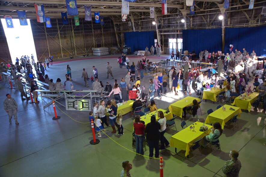 Families and friends of U.S. Air Force Airmen await the return of deployed members at Misawa Air Base, Japan, Oct. 16, 2015. The family members of the returning units support each other during rotational deployments, creating strong bonds between Misawa AB families. (U.S. Air Force photo by Senior Airman Jose Hernandez-Domitilo/Released)