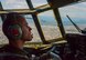 Capt. Matthieu Rigollet, 36th Airlift Squadron C-130 Hercules pilot, flies over Japan, Oct. 14, 2015. The crew flew past Mt. Fuji and performed a practice bundle drop as part of Yokota’s ongoing mission to keep all personnel ready to perform real world operations. (U.S. Air Force photo by Airman 1st Class Elizabeth Baker/Released)