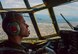 Capt. Matthieu Rigollet, 36th Airlift Squadron C-130 Hercules pilot, flies over Japan, Oct. 14, 2015. The crew flew past Mt. Fuji and performed a practice bundle drop as part of Yokota’s ongoing mission to keep all personnel ready to perform real world operations. (U.S. Air Force photo by Airman 1st Class Elizabeth Baker/Released)