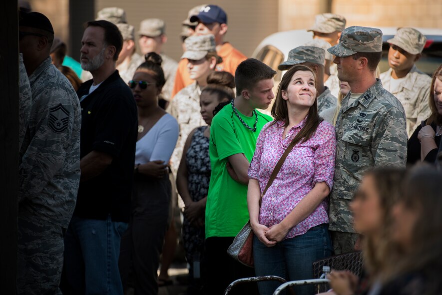 A couple shares a moment during the 824th Base Defense Squadron deployment ceremony, Oct. 16, 2015, at Moody Air Force Base, Ga. Friends and family members were in attendance to show their support of the 824th BDS as they prepare to deploy. (U.S. Air Force photo/Senior Airman Ryan Callaghan/Released)
