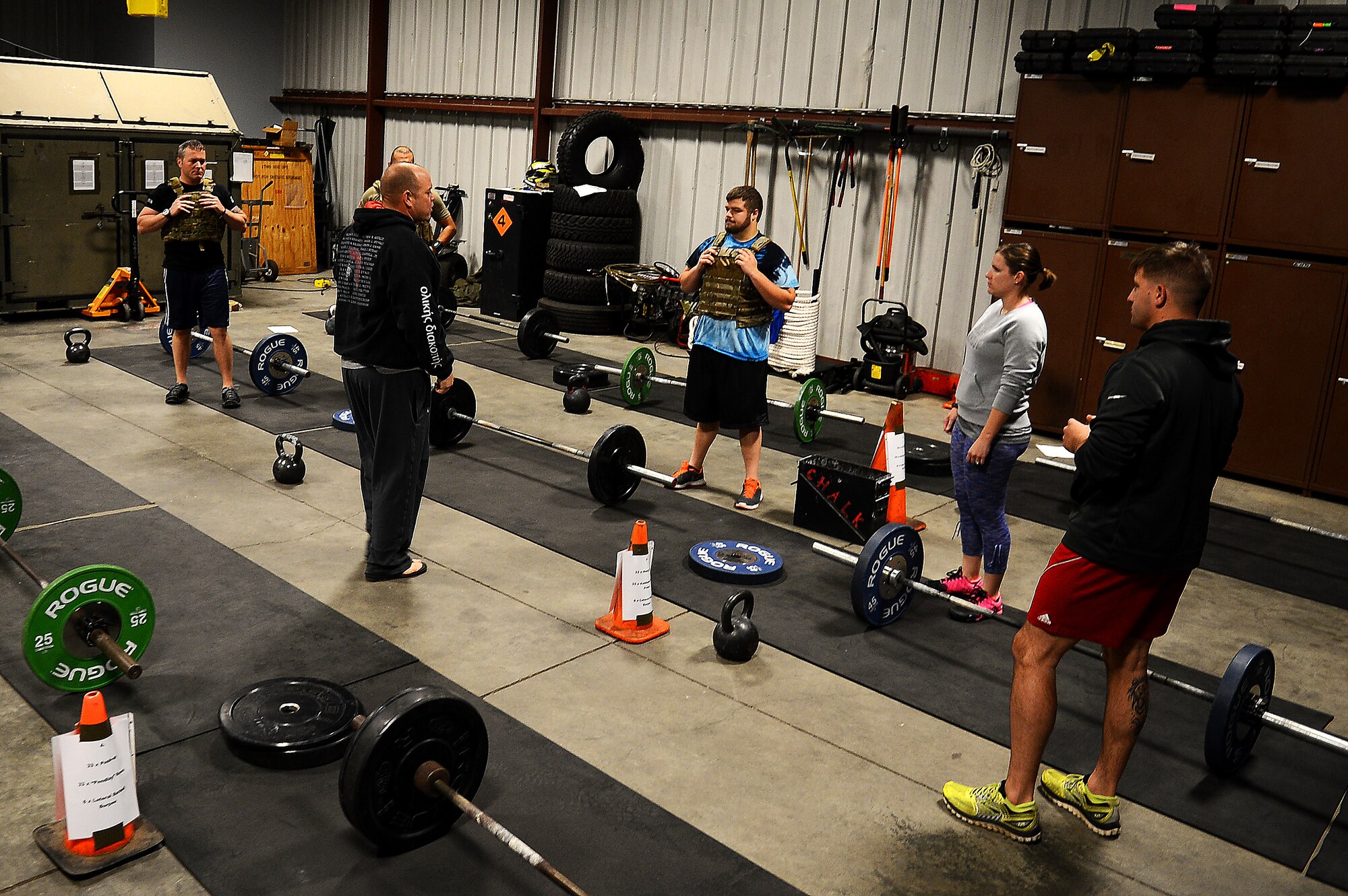 Team Shaw members listen to instructions before beginning the EOD 130 Memorial Workout at Shaw Air Force Base, S.C., Oct. 15, 2015. The EOD 130 is an extreme workout held in remembrance of the 130 Explosive Ordnance Disposal service members who have fallen in the line of duty since 9/11. (U.S. Air Force photo by Senior Airman Jonathan Bass/Released)