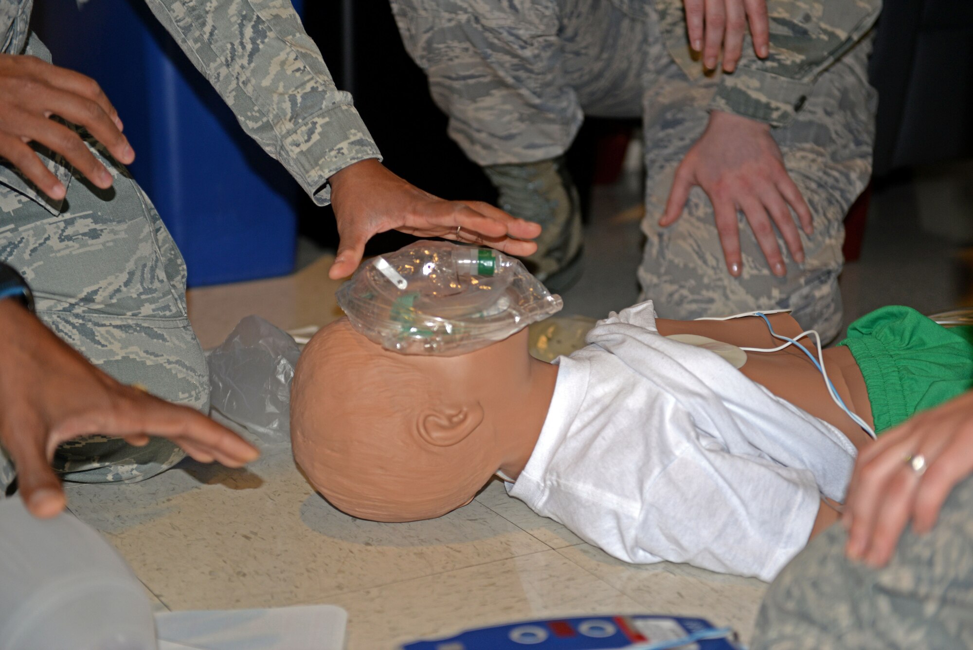 Airmen assigned to the 4th Medical Group apply an oxygen mask to a simulated victim during a Code Blue exercise, Oct. 16, 2015, at Seymour Johnson Air Force Base, North Carolina. Code Blue is a hospital emergency code used to alert medics of a patient requiring resuscitation, or in need of immediate medical attention. (U.S. Air Force photo/Airman 1st Class Ashley Williamson)