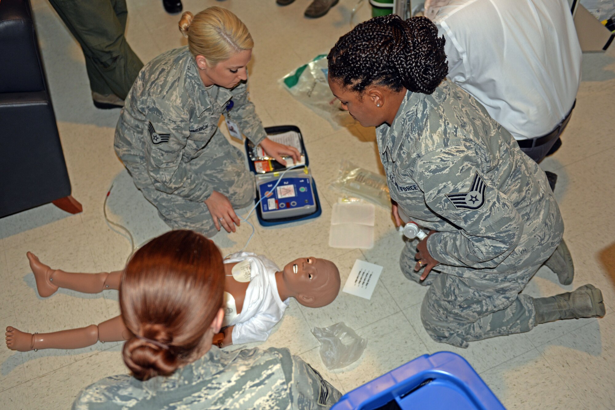 Airmen assigned to the 4th Medical Group attach an automated external defibrillator, or AED, to a simulated victim as part of a Code Blue exercise, Oct. 16, 2015, at Seymour Johnson Air Force Base, North Carolina. AEDs are used to restore a regular heart rhythm after a victim has suffered cardiac arrest. (U.S. Air Force photo/Airman 1st Class Ashley Williamson)