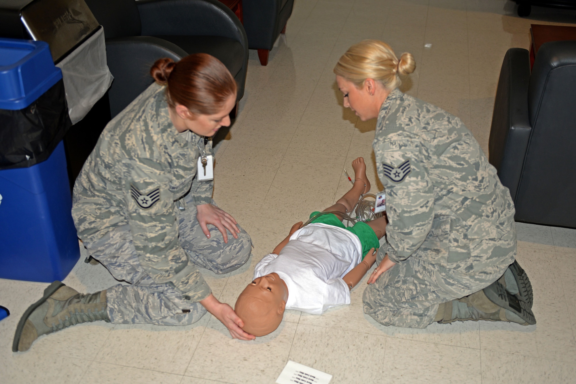 Staff Sgts. Richelle Hutto (left) and Nichole Sommerich, 4th Aerospace Medical Squadron medical technicians, respond to a trauma victim during a Code Blue exercise, Oct. 16, 2015, at Seymour Johnson Air Force Base, North Carolina. The exercise tested the Airmen’s ability to respond to a medical emergency and follow all proper protocols for the scenario. (U.S. Air Force photo/Airman 1st Class Ashley Williamson)